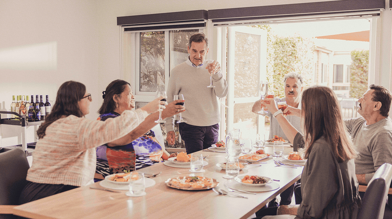Retouched_Group Toasting_Resized Hero
